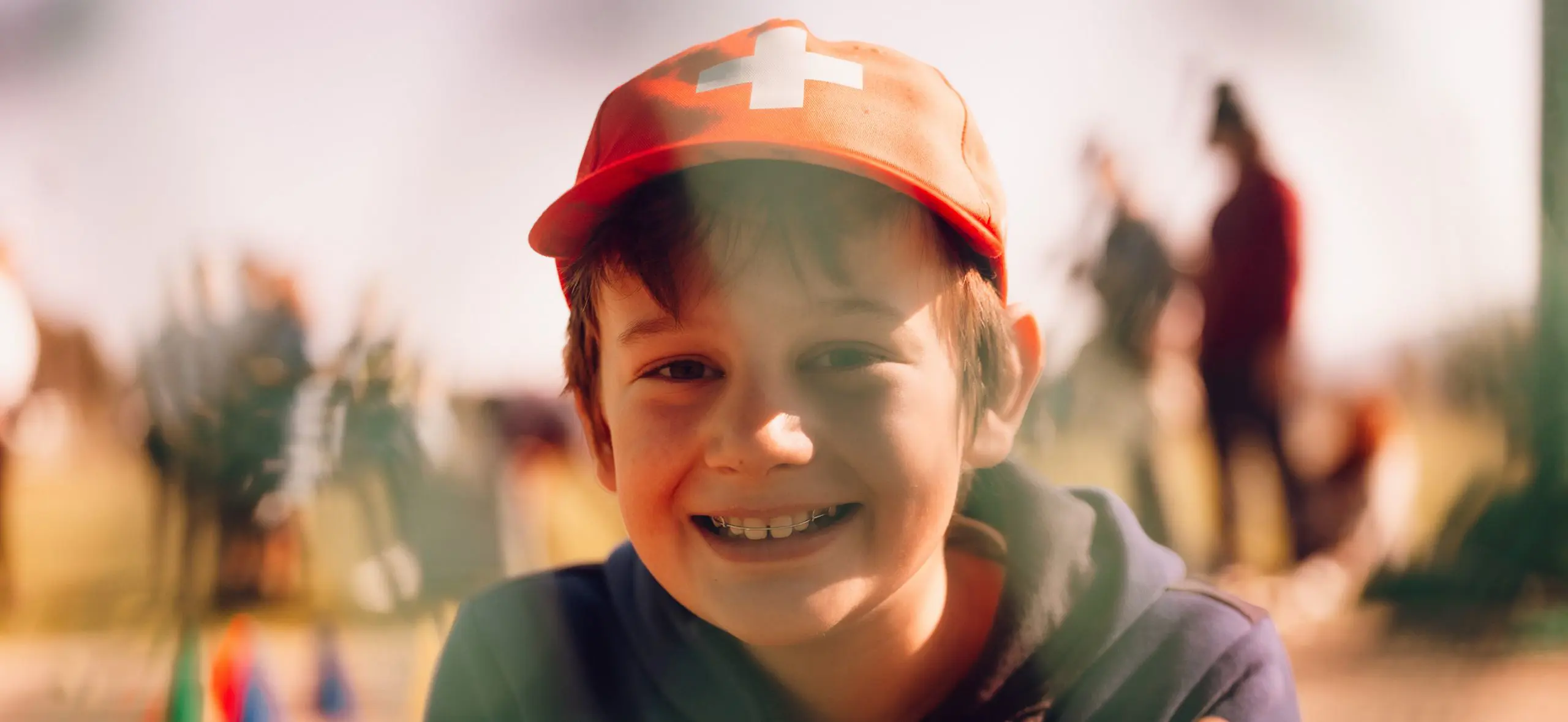Student outdoors smiling