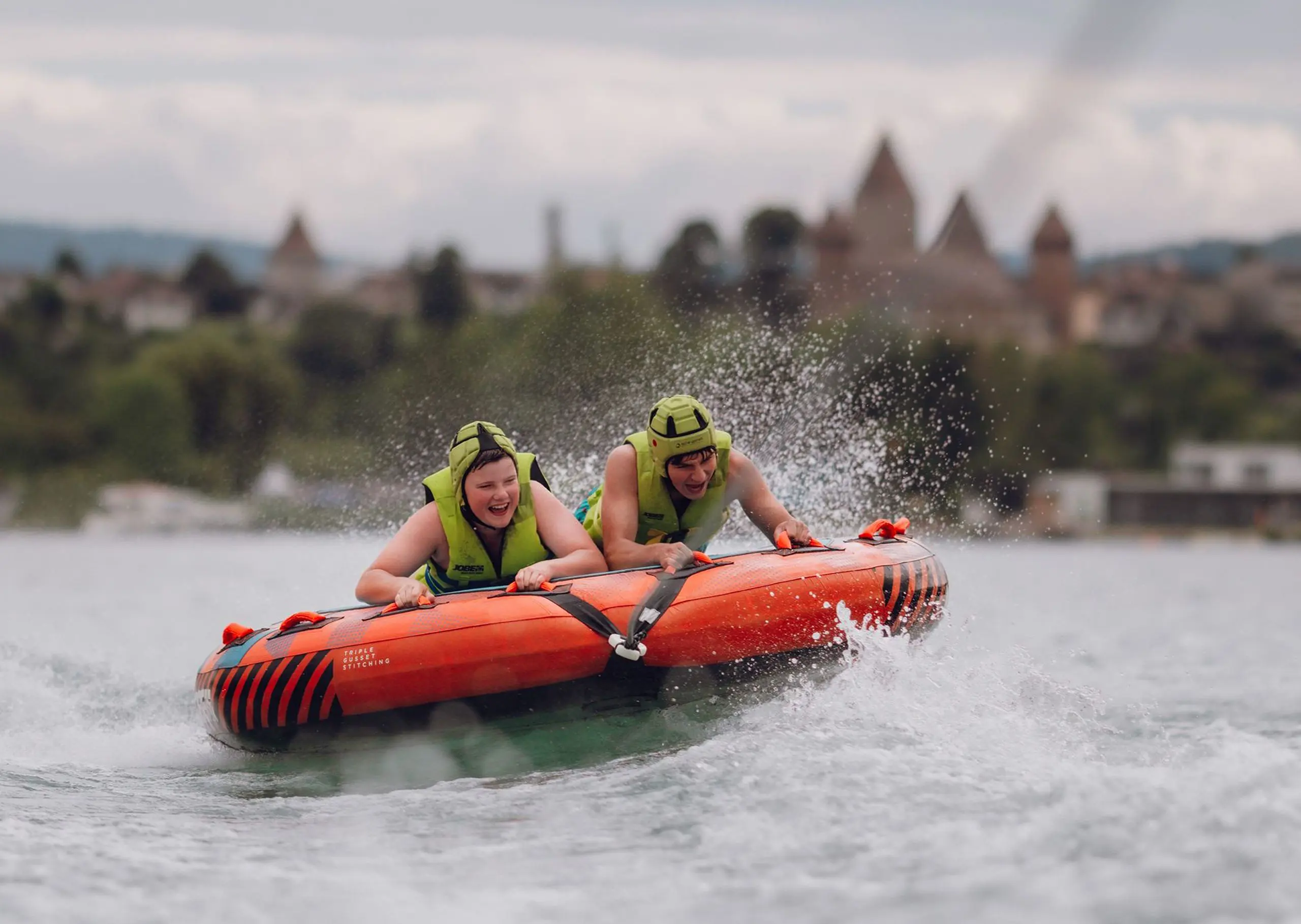 Students enjoying water activities in a lake