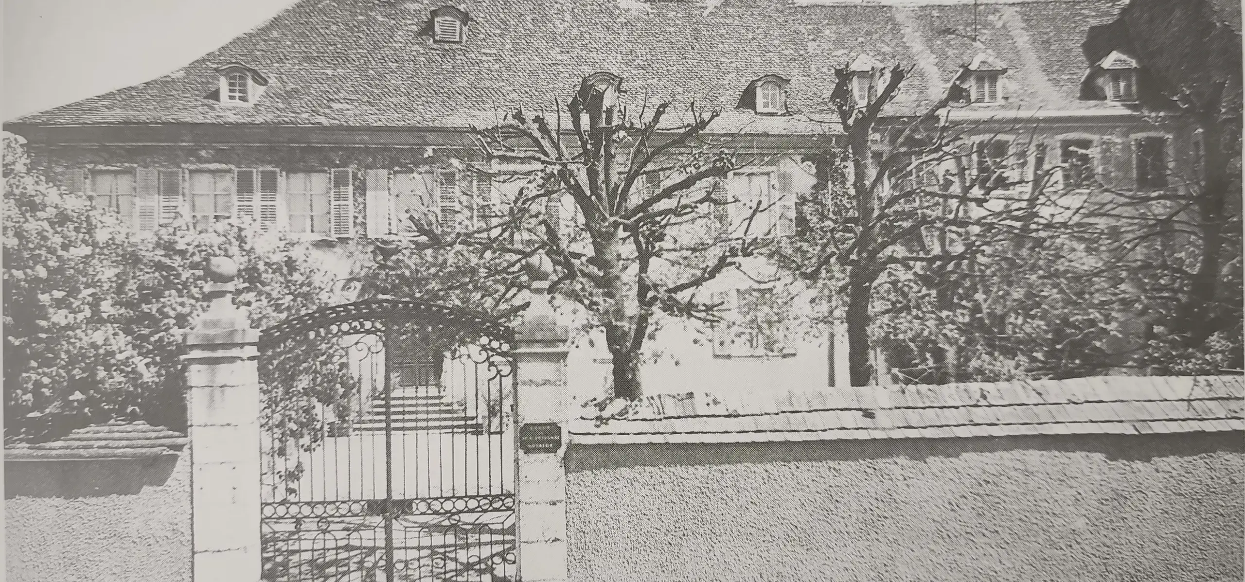 Historic black and white image of Saint Charles International School