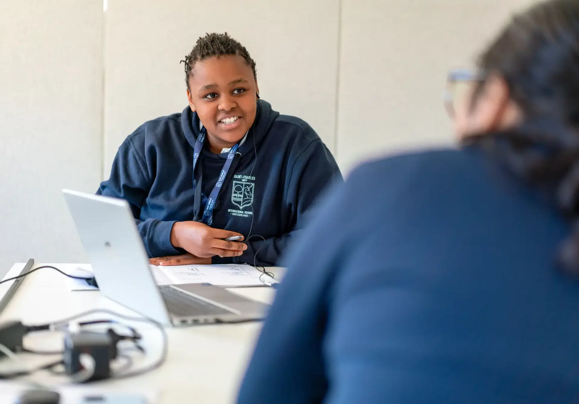 Students having a conversation in a classroom